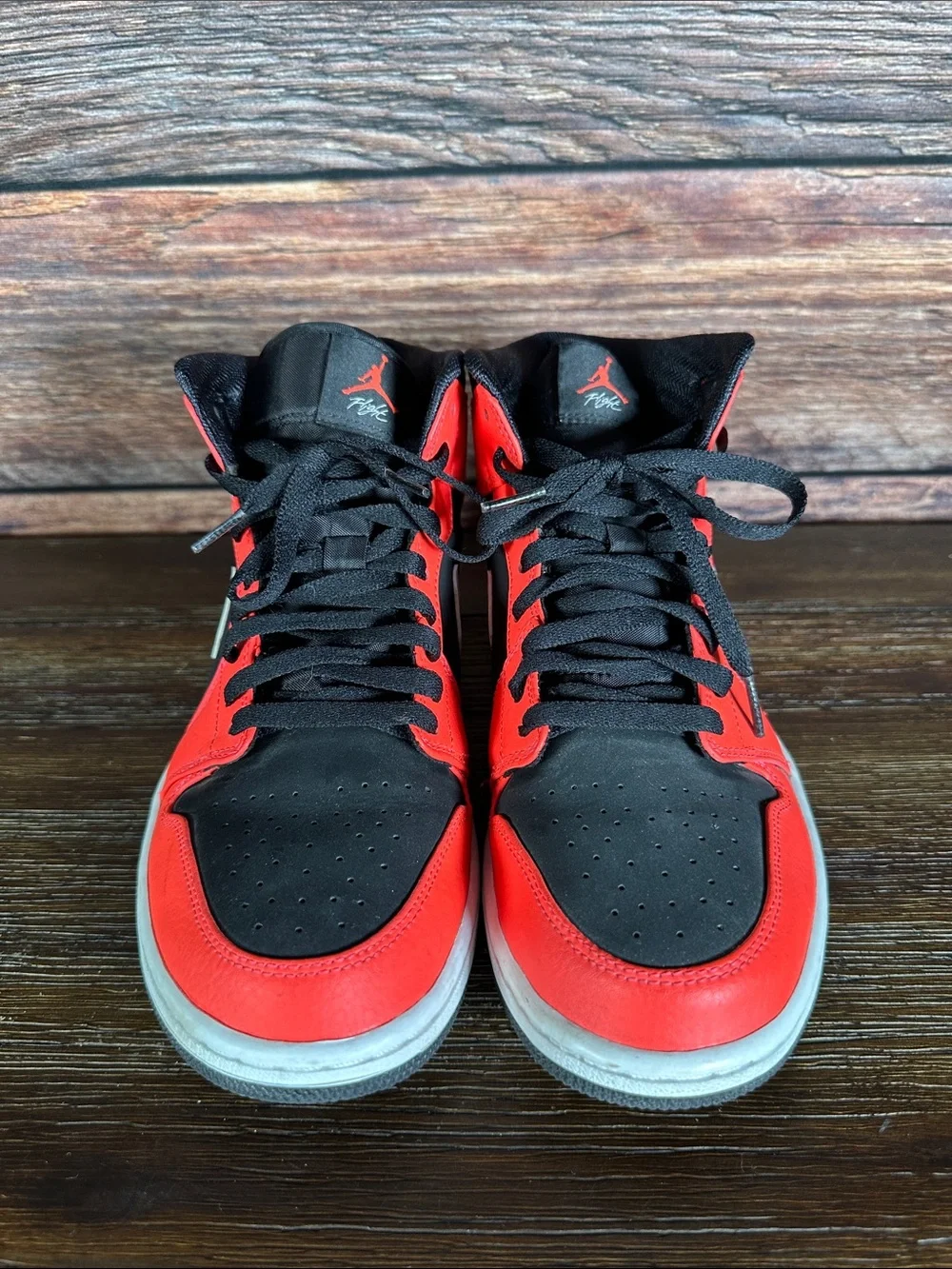 Nike Air Jordan 1 Mid Infrared 23 sneakers in Black and Neon Red